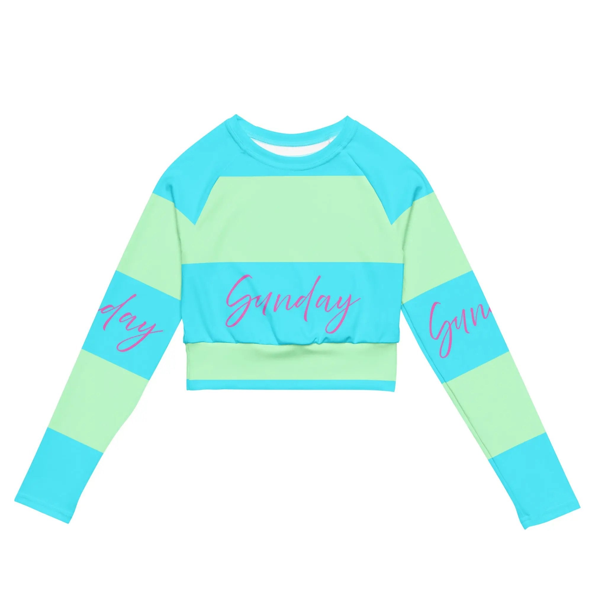 Eco-friendly recycled long-sleeve crop top in blue and green stripes with "Sunday" text, designed for comfort and UPF 50+ protection