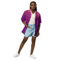 Woman wearing a purple to pink gradient Like a star Unisex button shirt with white sneakers and denim shorts
